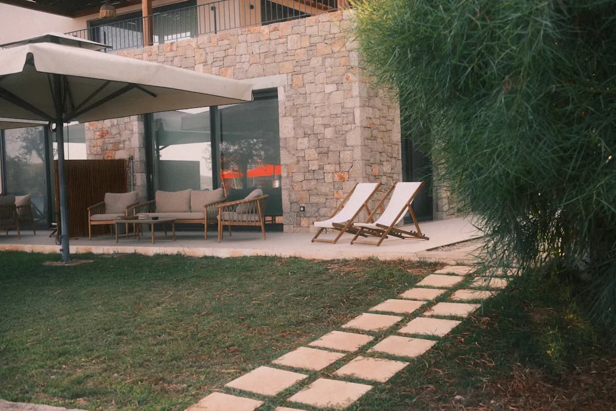 Stepping-stone path leading to a shaded patio
