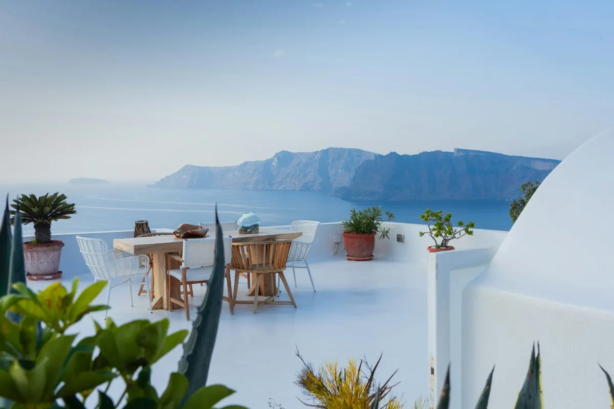 Paved outdoor dining terrace with a sea view