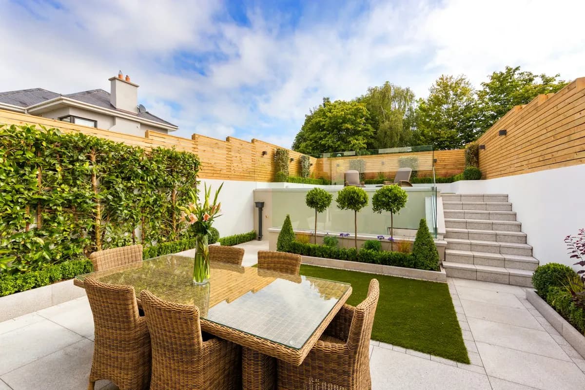 Courtyard patio with retaining walls, raised planting and steps